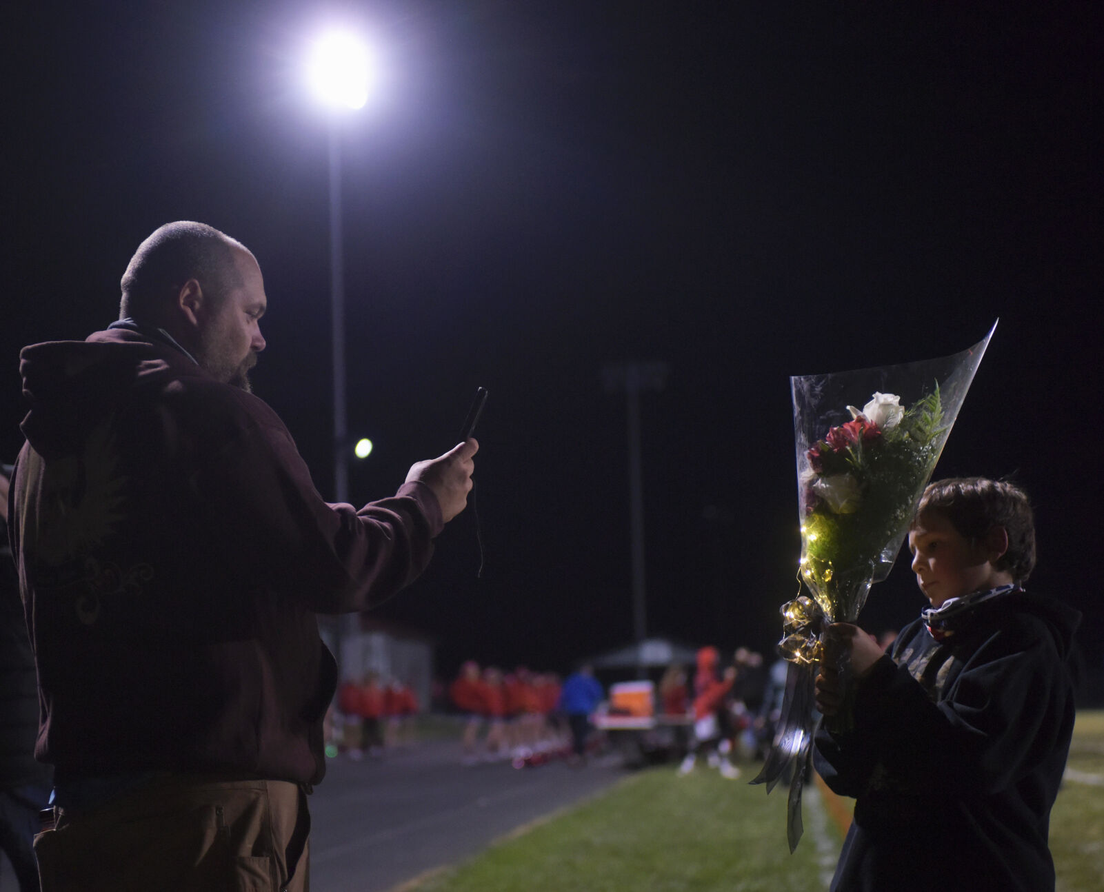 Michael Weisner, 10, poses for a photograph for his father